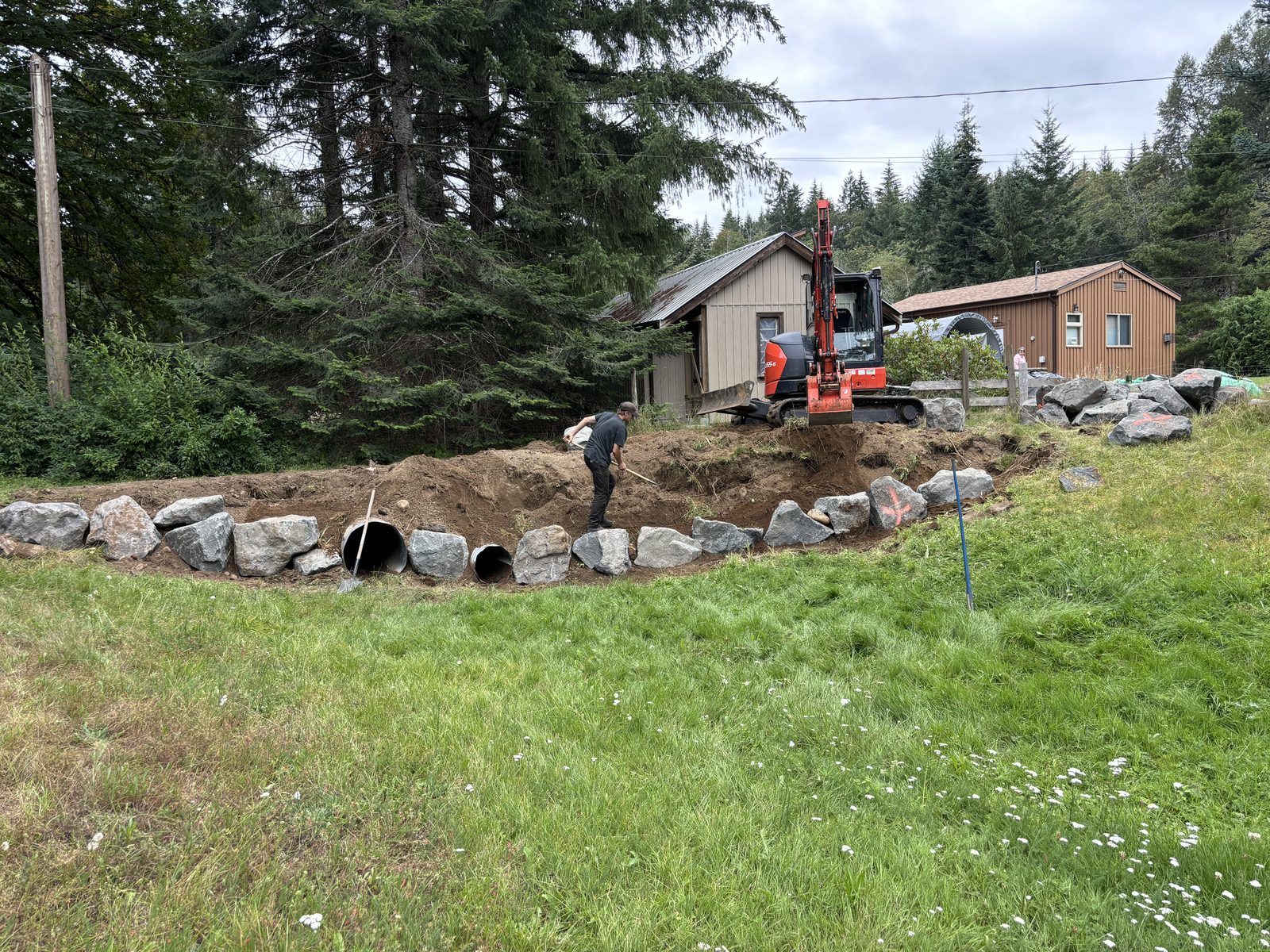 Boulder retaining wall progress Vancouver Island