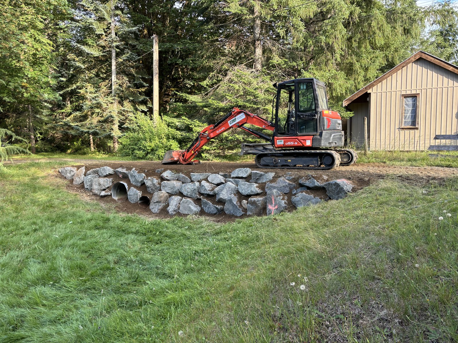 Completed natural boulder retaining wall Vancouver Island