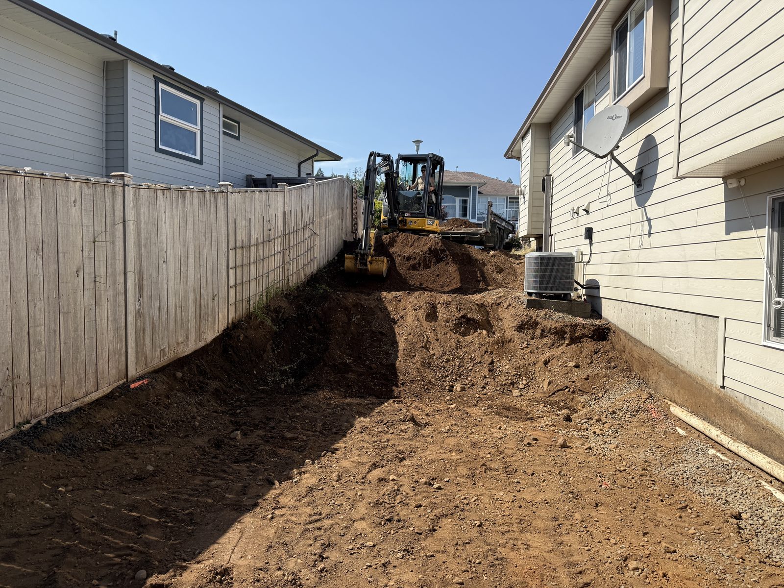 Tiered retaining wall base preparation Vancouver Island