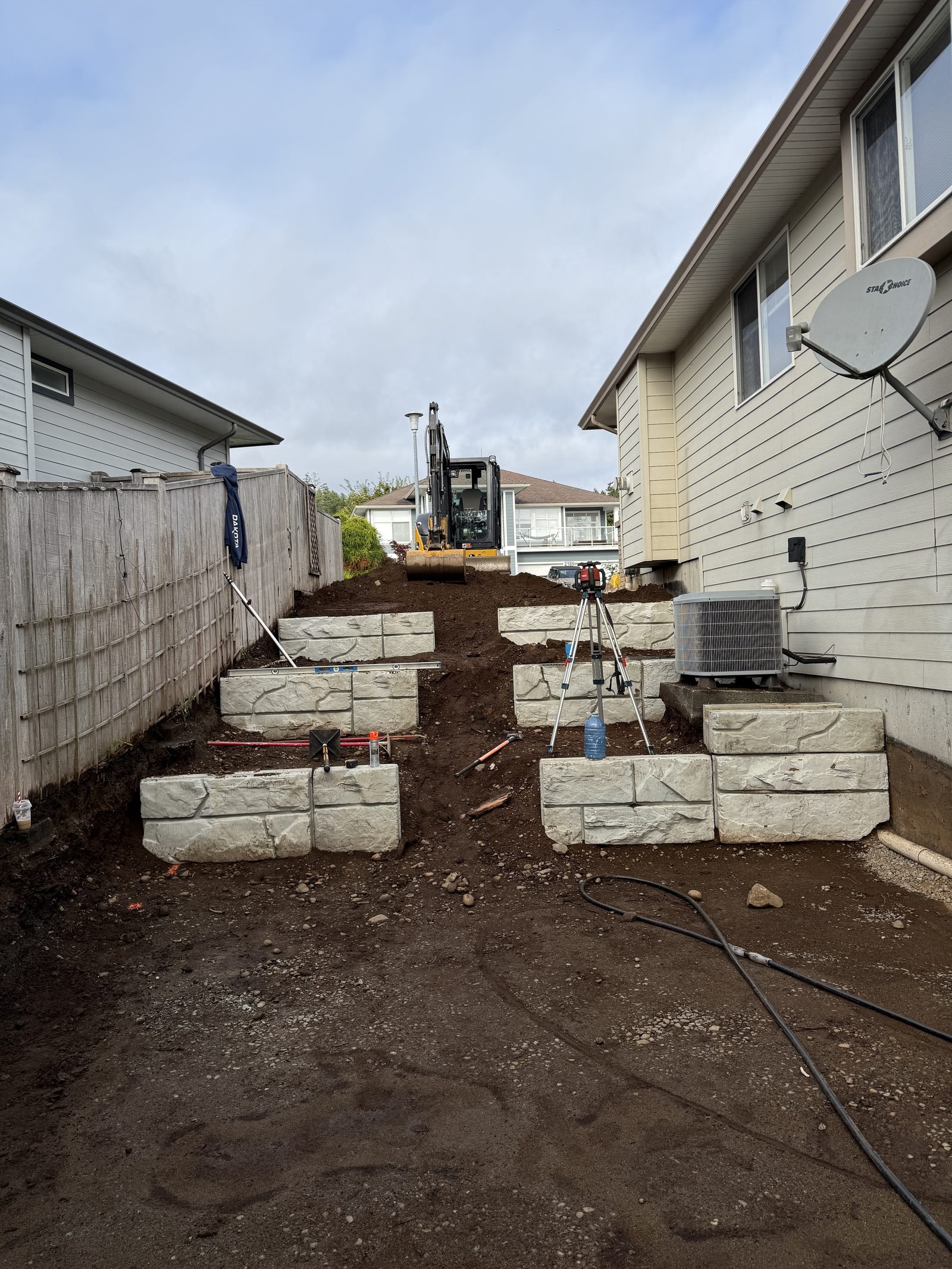 Tiered retaining wall first tier construction Vancouver Island