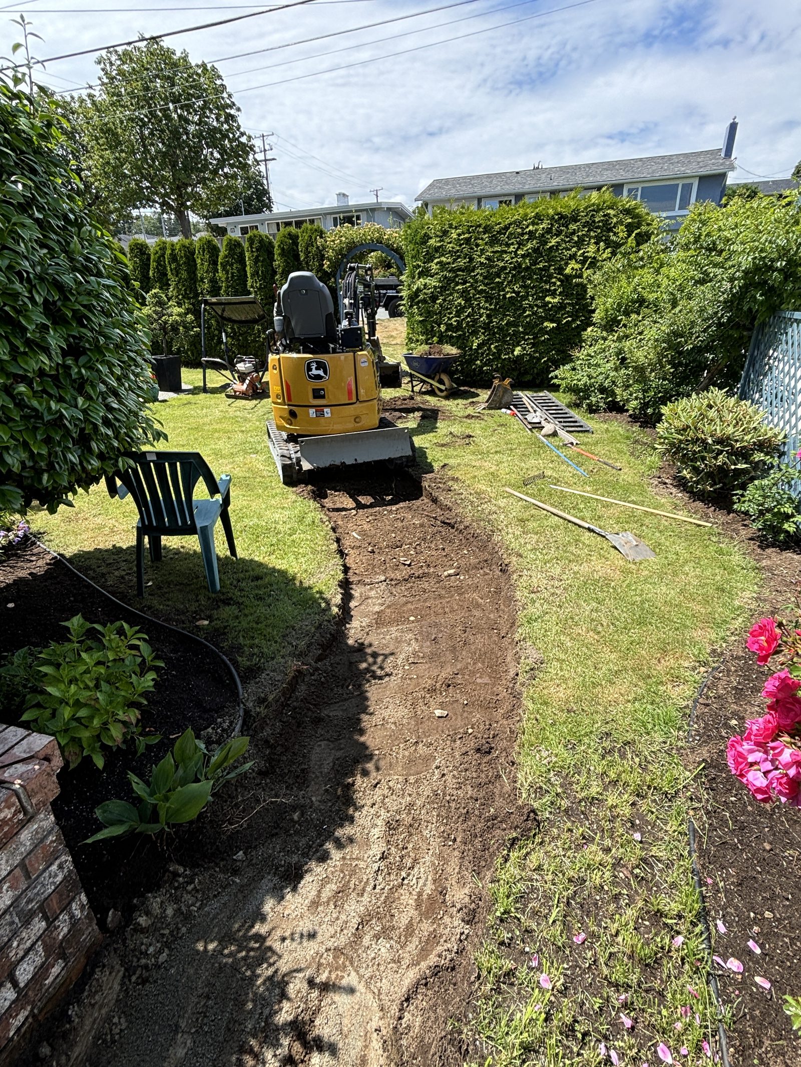Winding concrete pathway excavation Vancouver Island